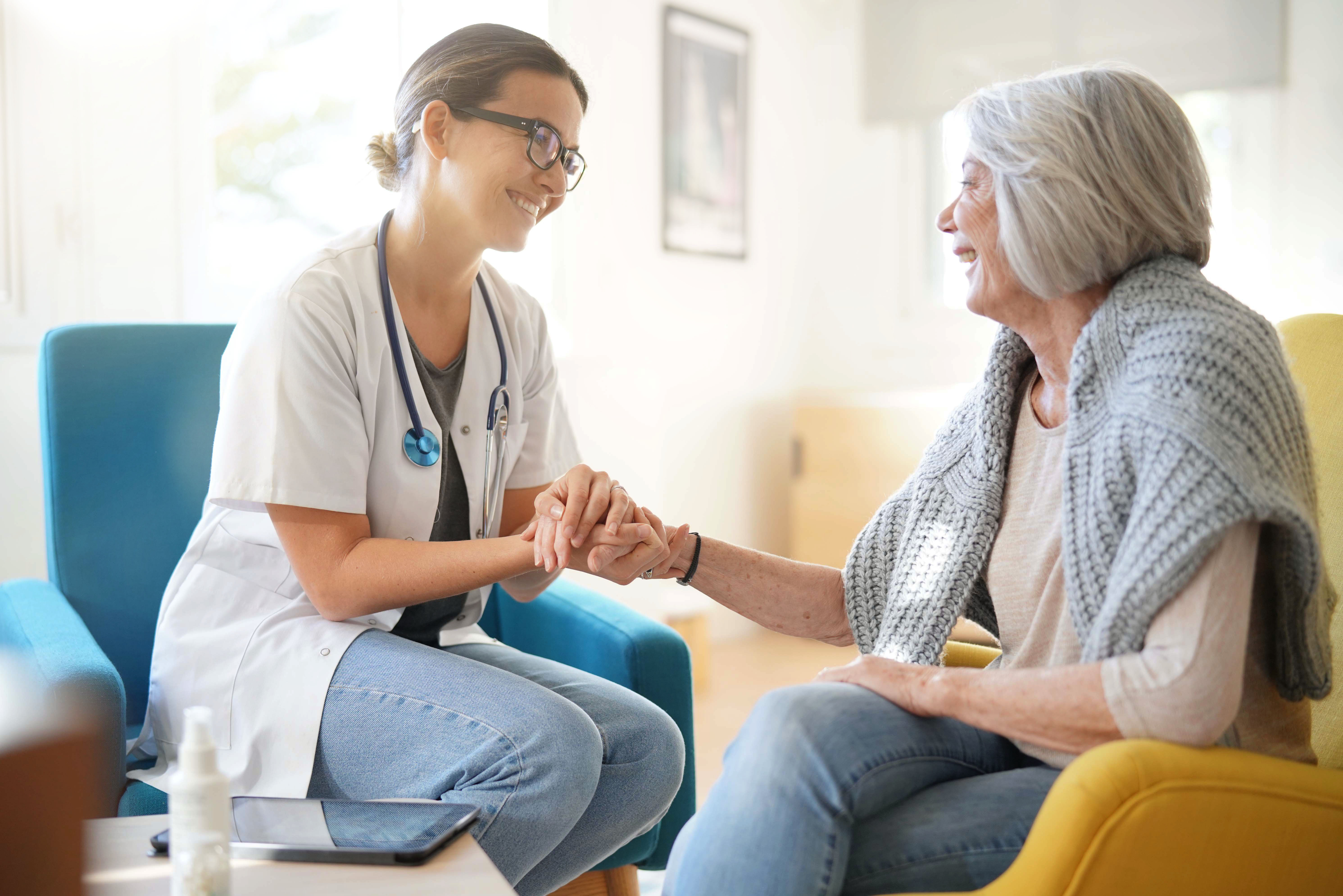 Doctor providing compassionate care to elderly patient